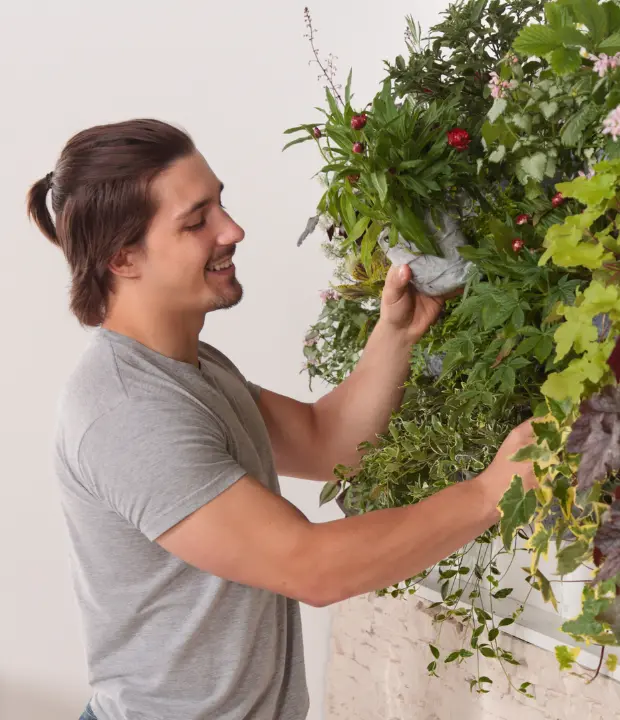 man takin care of plants