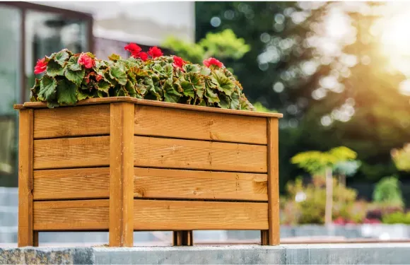 freestanding modular planter with red flowers